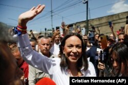 La líder opositora María Corina Machado llega a votar durante las elecciones presidenciales en Caracas, Venezuela, el domingo 28 de julio de 2024. (Foto AP/Cristian Hernandez)