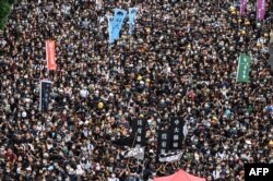 Estudiantes de la Universidad China de Hong Kong en una marcha el 2 de septiembre (Foto: Philip Fong/AFP).