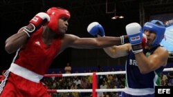 Robert Alfonso (i), se enfrenta al brasileño Antonio Nogueira, por las semifinales de la categoría +91 kg, en el marco de los Juegos Panamericanos Río de Janeiro 2007.