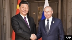 Xi Jinping con Vladimir Putin en julio del 2018.